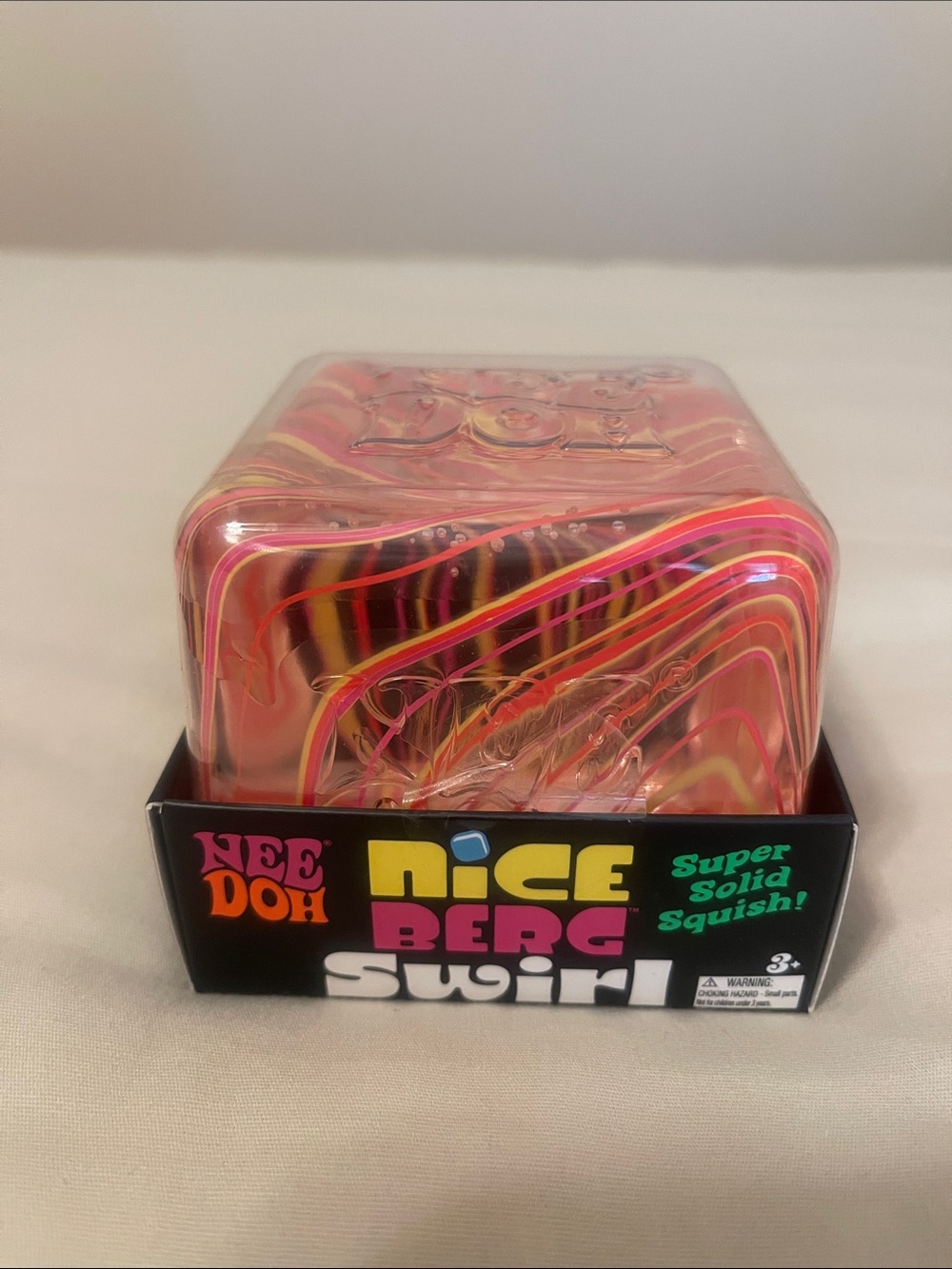 NeeDoh Nice Berg Swirl Squish Toy - Pink, Yellow, Orange Swirl